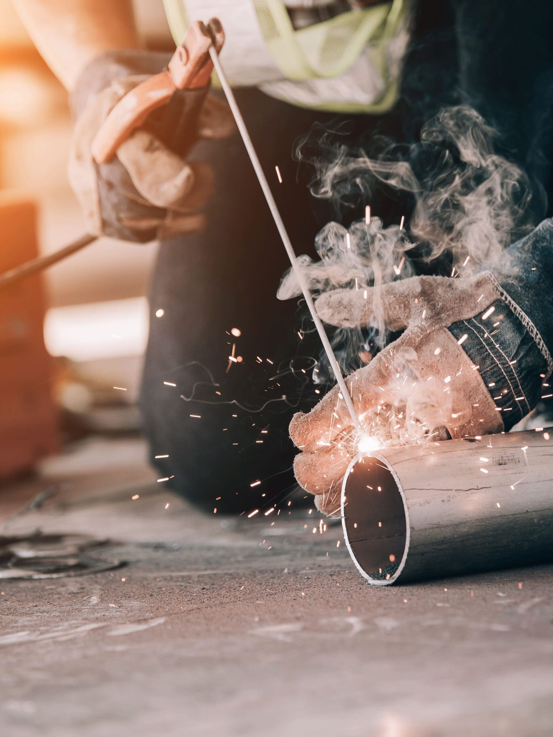 Close-up of a pipe being welded.