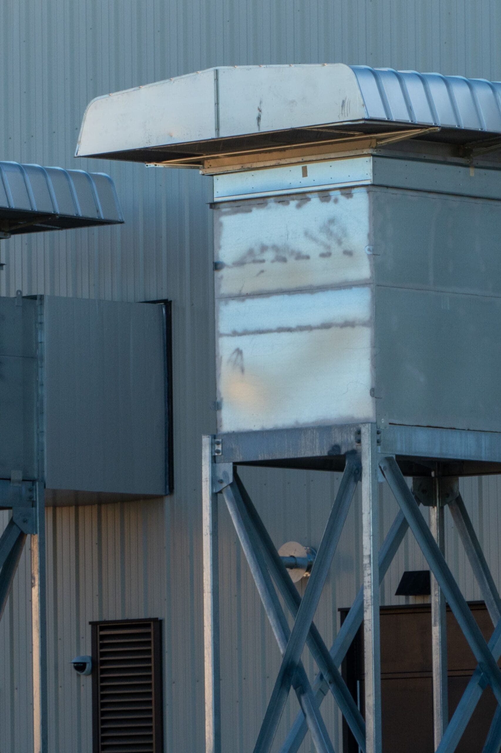 Industrial ventilation systems with large metal exhaust stacks